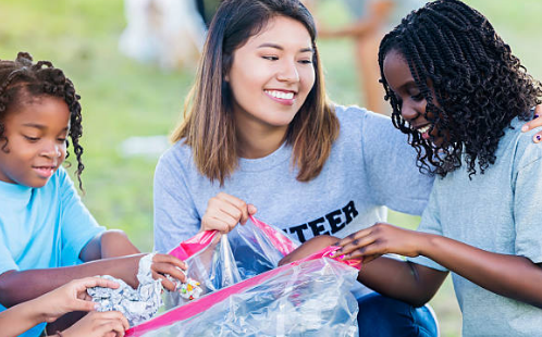 Young adult and kids volunteering